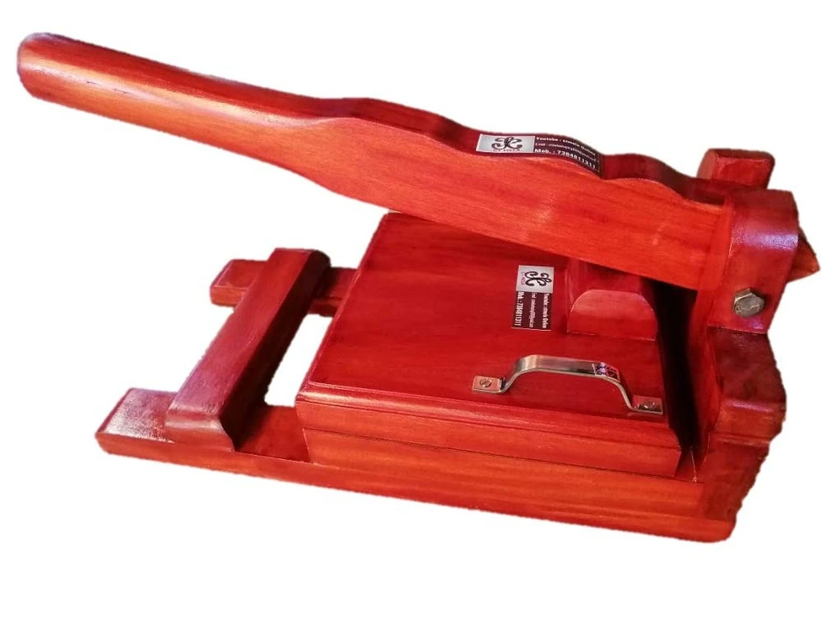 Dlaczego profesjonalni kucharze zawsze trzymają tę drewnianą prasę w swojej kuchni - image 1